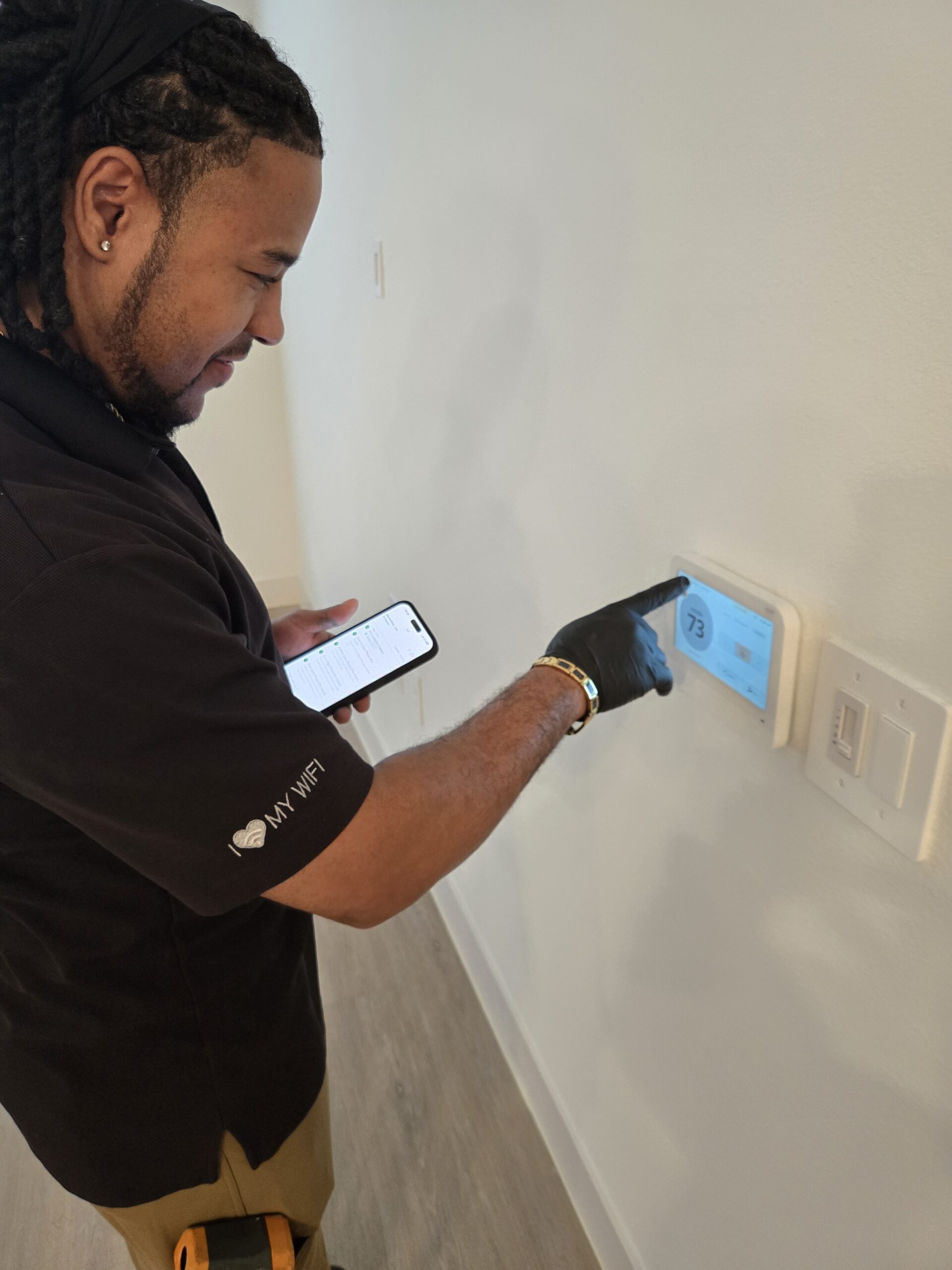 Homeowner using wall panel to control lights and security in a Texas home