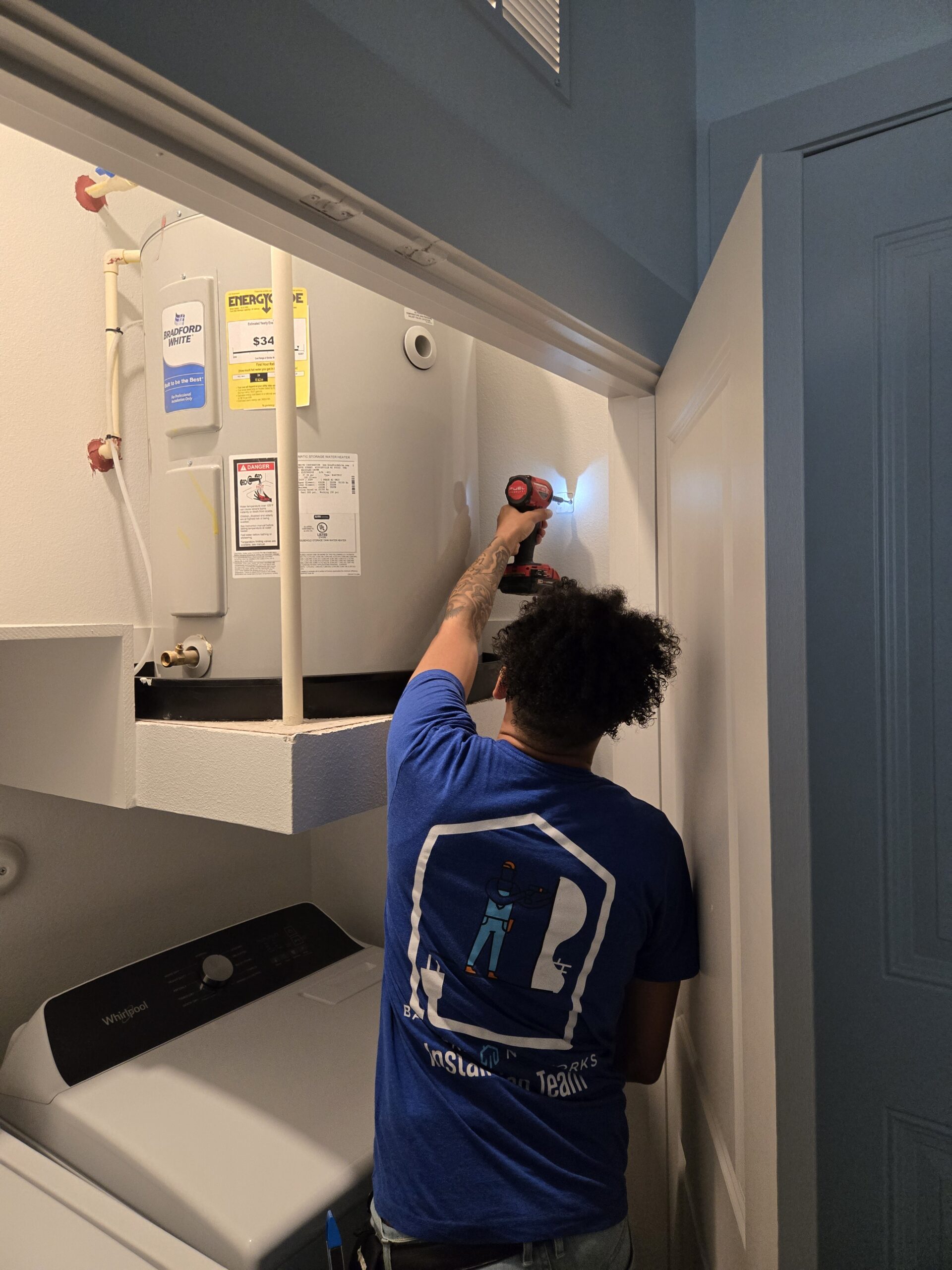 Technician configuring integrated smart home controls with careful system testing and setup