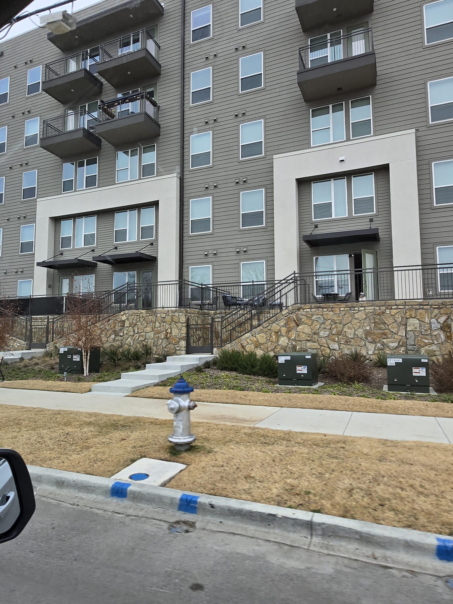 Network specialist testing signal strength and configuring residential Wi-Fi equipment professionally